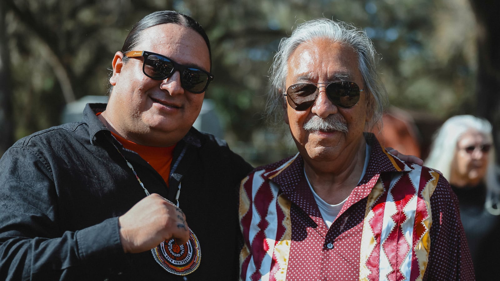 In this photo released by Native American activist Leonard Peltier, right, poses for pictures with Nick Tilsen, CEO of NDN Collective, an Indigenous-led advocacy group based in South Dakota, as he was released from a Florida prison on Tuesday, Feb. 18, 2025, weeks after then-President Joe Biden angered law enforcement officials by commuting his life sentence to home confinement in the 1975 killings of two FBI agents. (Angel White Eyes, NDN Collective via AP)