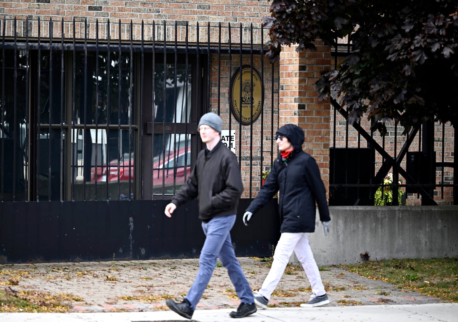 People walk past The High Commission of India in Canada, in Ottawa, Ontario, on Monday, Oct. 14, 2024. (Justin Tang/The Canadian Press via AP)