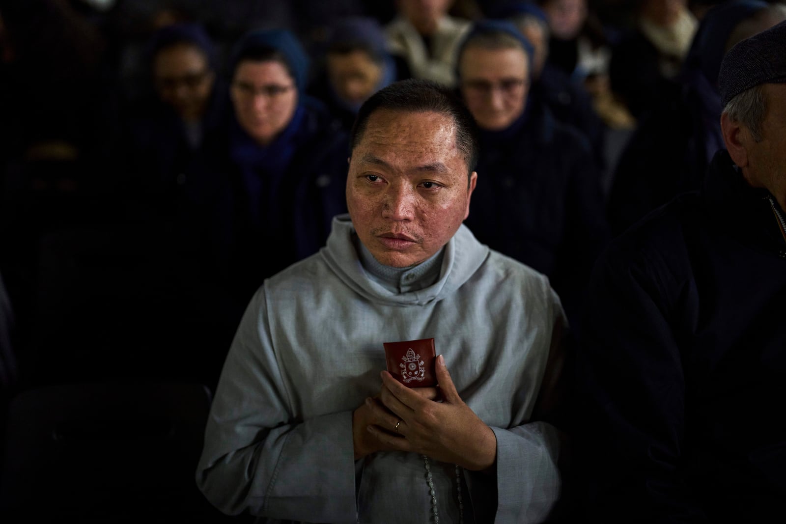 A Catholic man attends a nightly rosary prayer service for the health of Pope Francis in St. Peter's Square at the Vatican, Thursday, March 6, 2025. (AP Photo/Francisco Seco)