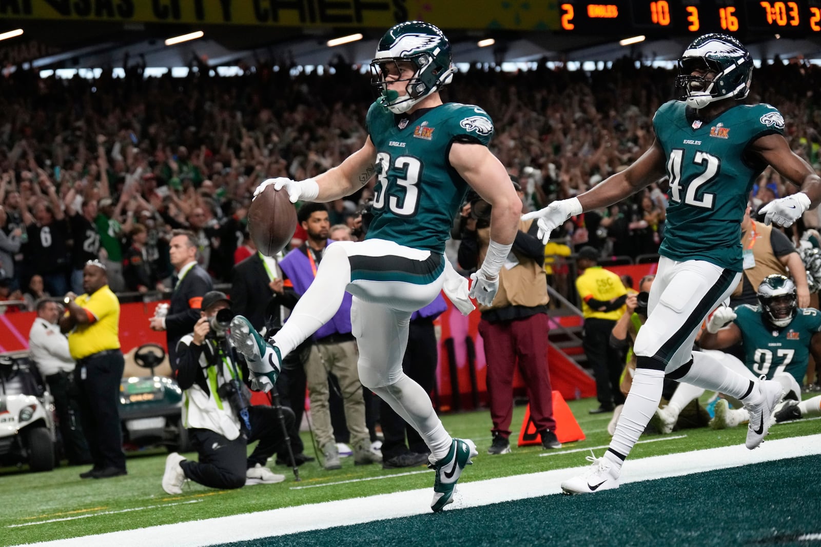 Philadelphia Eagles defensive back Cooper DeJean (33) scores a touchdown after intercepting a pass during the first half of the NFL Super Bowl 59 football game against the Kansas City Chiefs, Sunday, Feb. 9, 2025, in New Orleans. (AP Photo/George Walker IV)