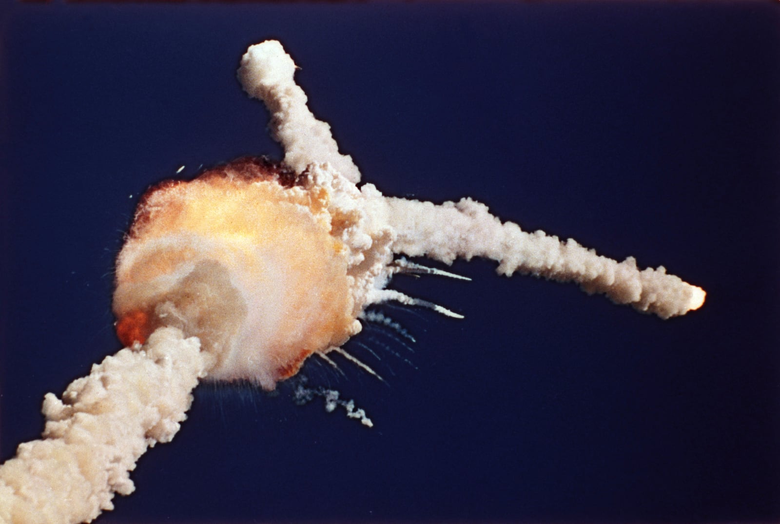 The space shuttle Challenger is destroyed shortly after lifting off, Tuesday, Jan. 28, 1986, at the Kennedy Space Center in Florida. The crew of seven, including NASA's first teacher in space Christa McAuliffe, died in the explosion. (AP Photo/Bruce Weaver, File)