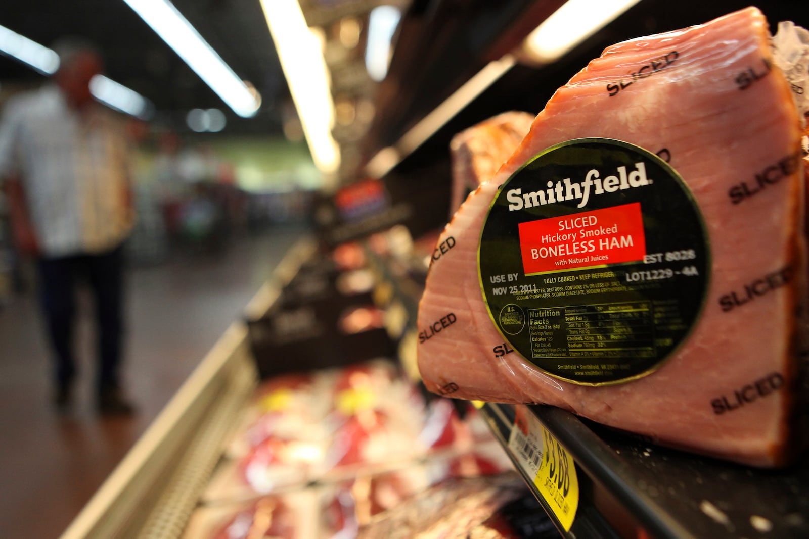 FILE - In this Sept. 6, 2011, file photo, shows a Smithfield ham at a grocery store in Richardson, Texas. (AP Photo/LM Otero, File)