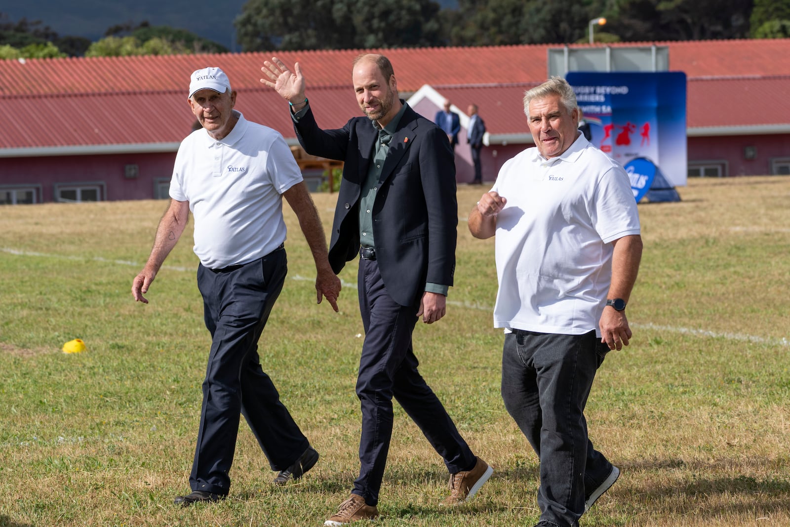 Britain's Prince William waves at well wishers during his visit at the Ocean View Secondary School in Cape Town, South Africa, Monday, Nov. 4, 2024. (AP Photo/Jerome Delay-pool)