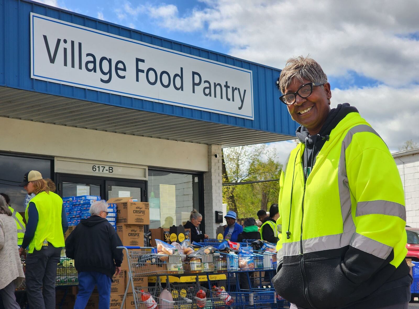 Pam Benson poses for a portrait photo outside the Village Food Pantry in New Miami.