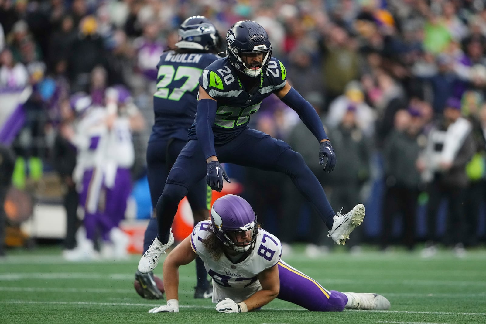 Seattle Seahawks safety Julian Love (20) celebrates after forcing a incomplete pass intended for Minnesota Vikings tight end T.J. Hockenson (87) during the second half of an NFL football game, Sunday, Dec. 22, 2024, in Seattle. (AP Photo/Lindsey Wasson)