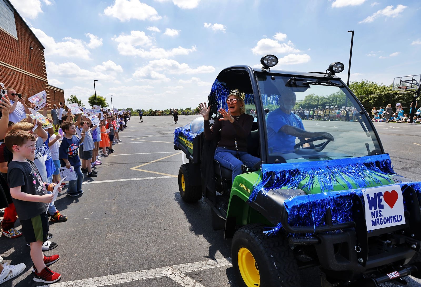 Ridgeway Elementary School principal Kathy Wagonfield was honored by teachers and hundreds of students Thursday, May 2, 2024 in Hamilton. She was surprised during a secret assembly to celebrate her. A tree was planted in her honor in front of the school. NICK GRAHAM/STAFF