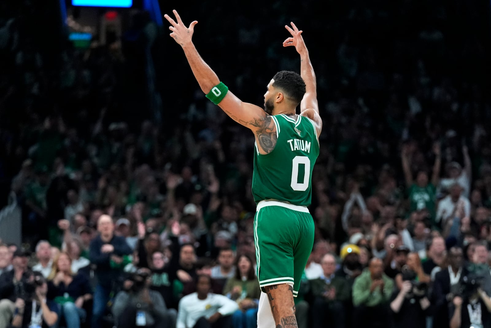 Boston Celtics forward Jayson Tatum (0) celebrates after a 3-pointer during the second half of an NBA basketball game against the New York Knicks, Tuesday, Oct. 22, 2024, in Boston. (AP Photo/Charles Krupa)