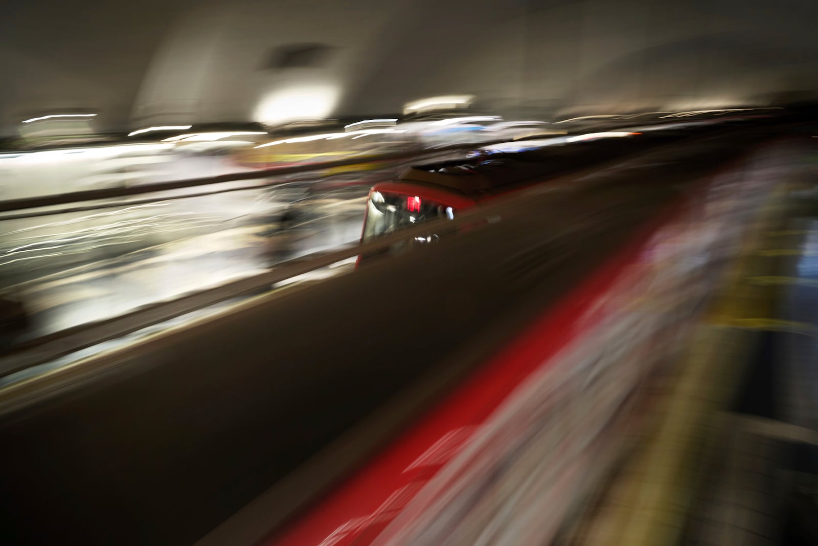 Metro trains come and go picking up and dropping off passengers at a Barcelona metro station Spain, Monday, Dec. 2, 2024. (AP Photo/Emilio Morenatti)