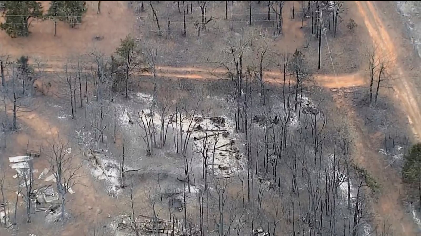 This image provided by shows aerials over the damage caused by the wildfires in Logan County, Okla. (KOCO via AP)