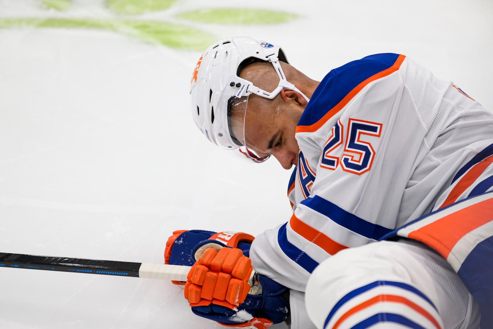 Edmonton Oilers defenseman Darnell Nurse (25) lays on the ice after colliding with Toronto Maple Leafs right wing Ryan Reaves (75) during the second period of an NHL hockey game, Saturday, Nov. 16, 2024 in Toronto. (Christopher Katsarov/The Canadian Press via AP)