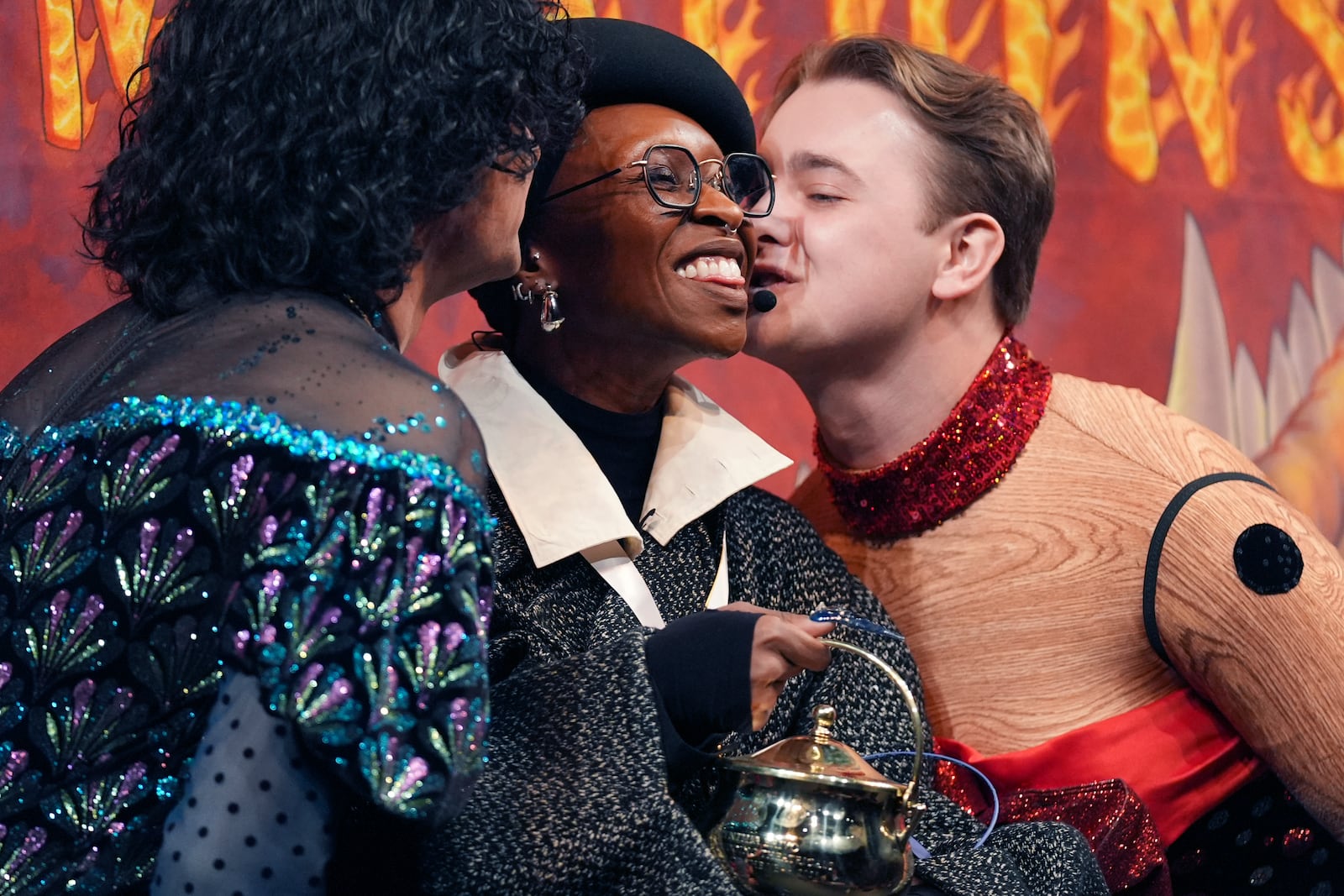 Harvard University's Hasty Pudding Theatricals Woman of the Year Cynthia Erivo is kissed by two character actors during a roast, Wednesday, Feb. 5, 2025, in Cambridge, Mass. (AP Photo/Charles Krupa)