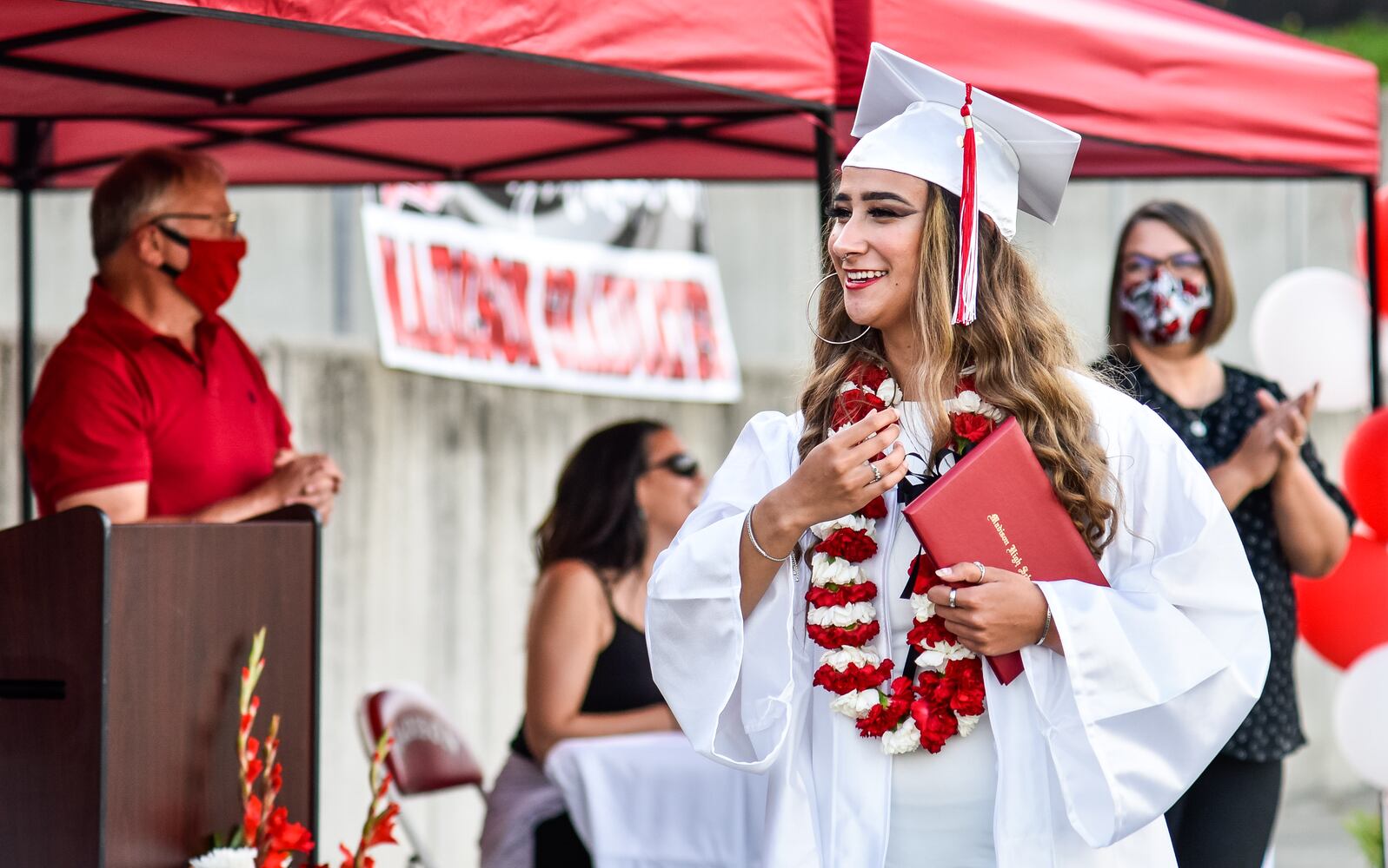 Madison High School drive-thru graduation ceremony at Land of Illusion