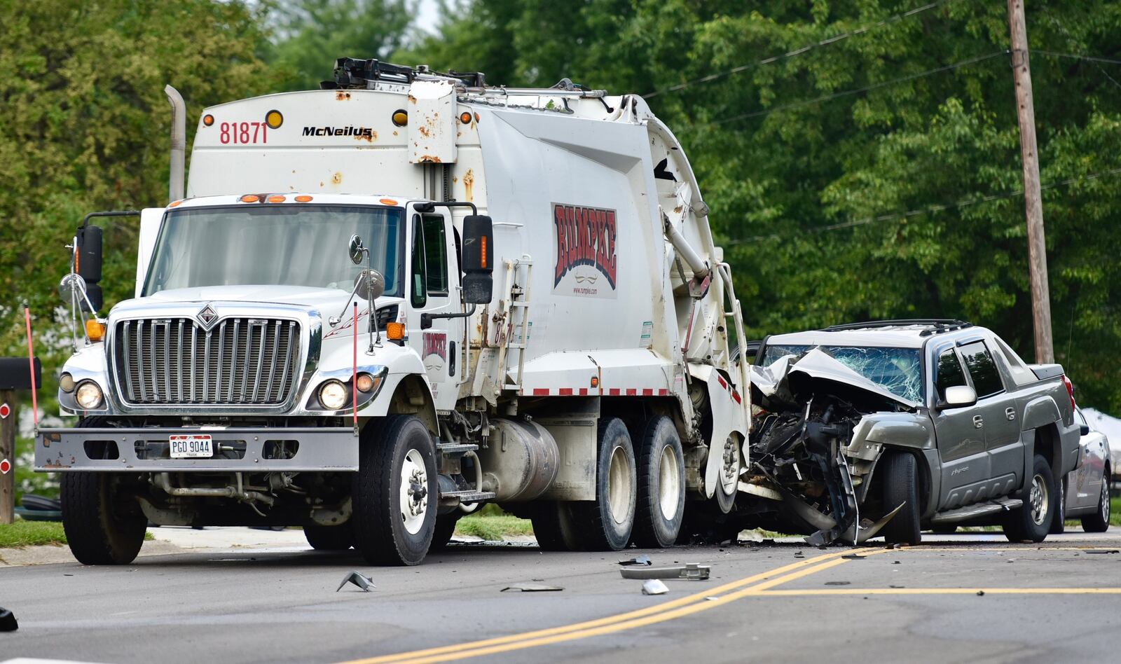 A Rumpke employee was pinned between the back of a trash truck and a pickup truck in a crash Monday morning in Middletown. 