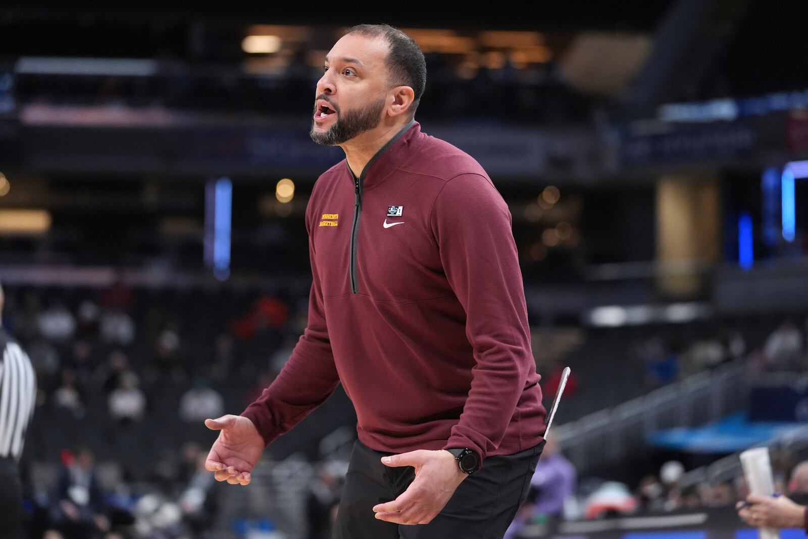 Minnesota head coach Ben Johnson watches against Northwestern during the first half of an NCAA college basketball game in the first round of the Big Ten Conference tournament in Indianapolis, Wednesday, March 12, 2025. (AP Photo/Michael Conroy)