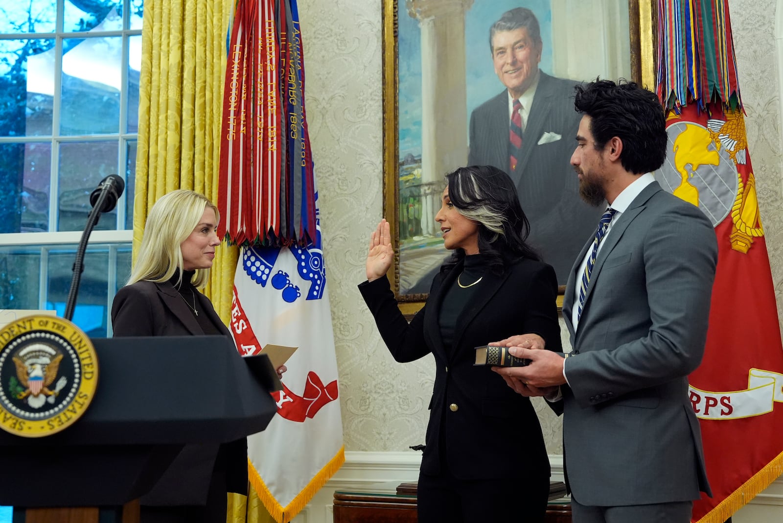 Attorney General Pam Bondi swears in Tulsi Gabbard as the Director of National Intelligence in the Oval Office of the White House, Wednesday, Feb. 12, 2025, in Washington, as her husband Abraham Williams watches. (Photo/Alex Brandon)