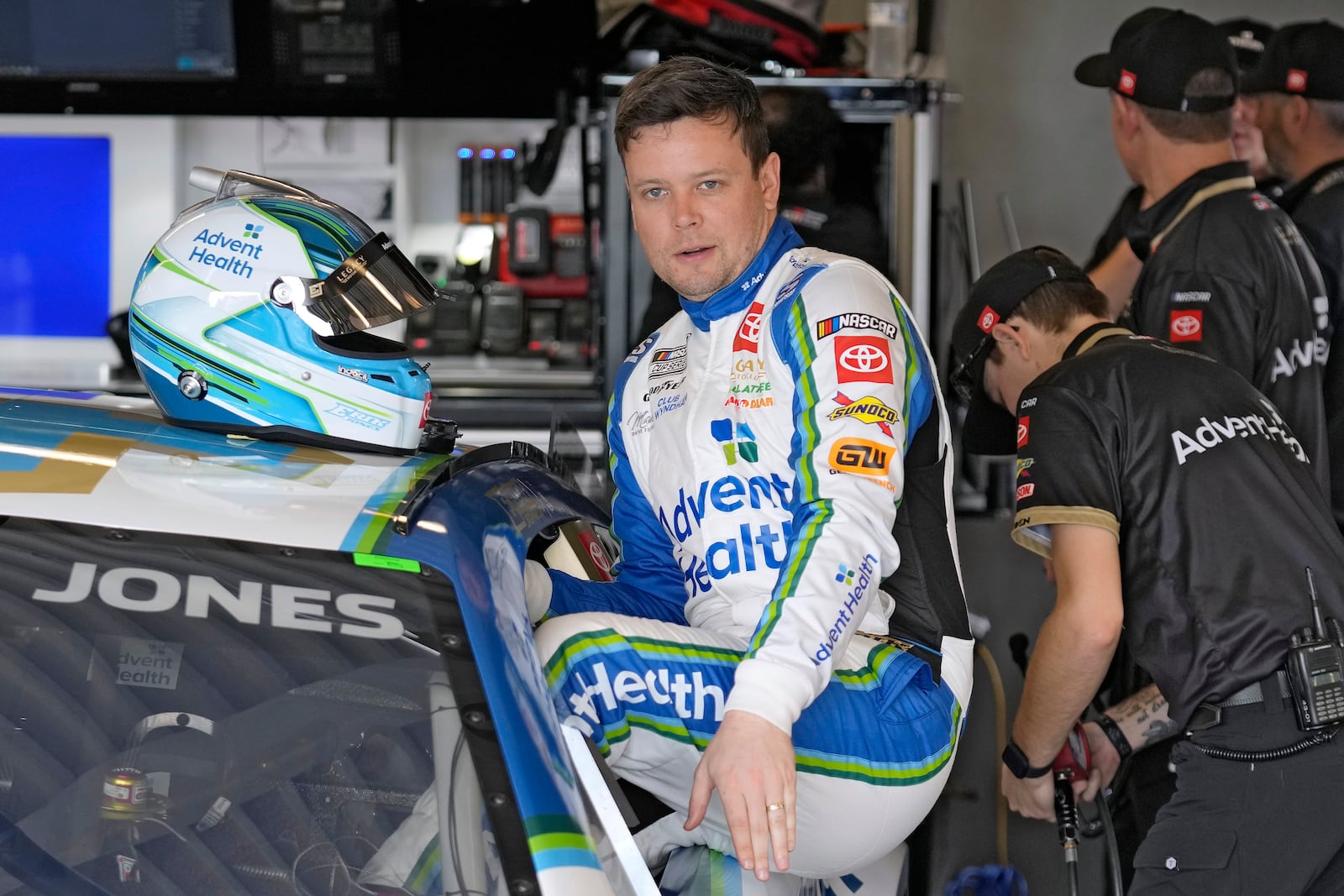 Erik Jones climbs into his car during a practice for the NASCAR Daytona 500 auto race Wednesday, Feb. 12, 2025, at Daytona International Speedway in Daytona Beach, Fla. (AP Photo/Chris O'Meara)