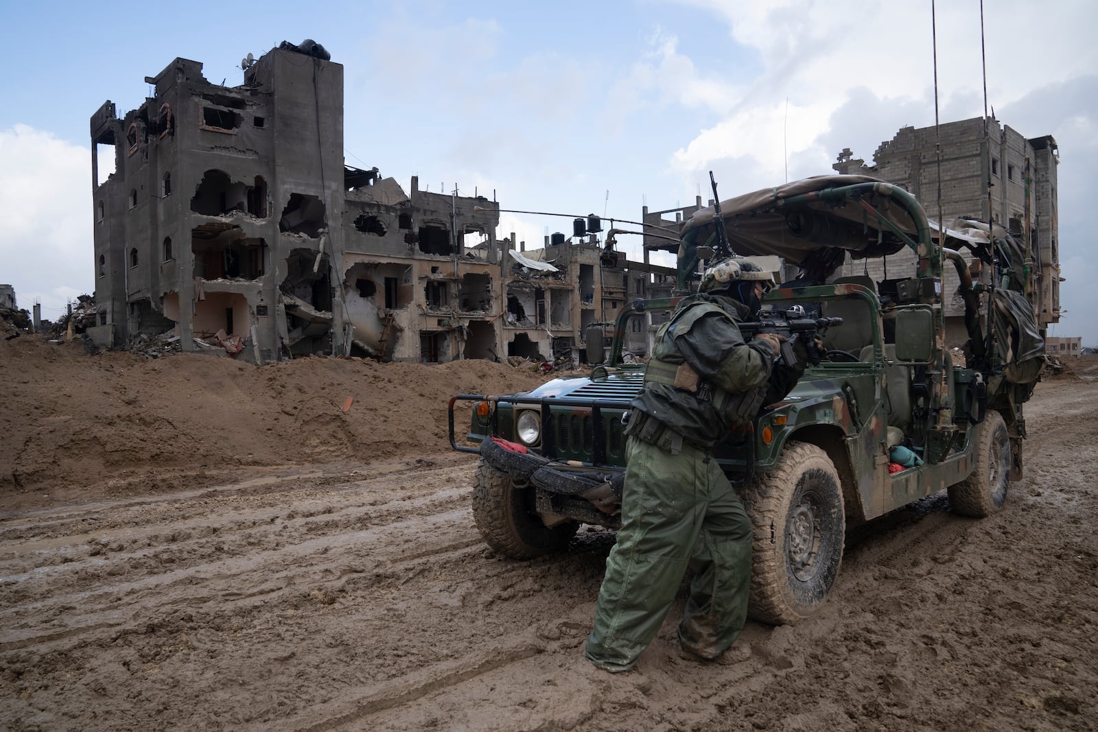 FILE - An Israeli soldier stands guard in Khan Younis, Jan. 27, 2024. (AP Photo/Sam McNeil, File)