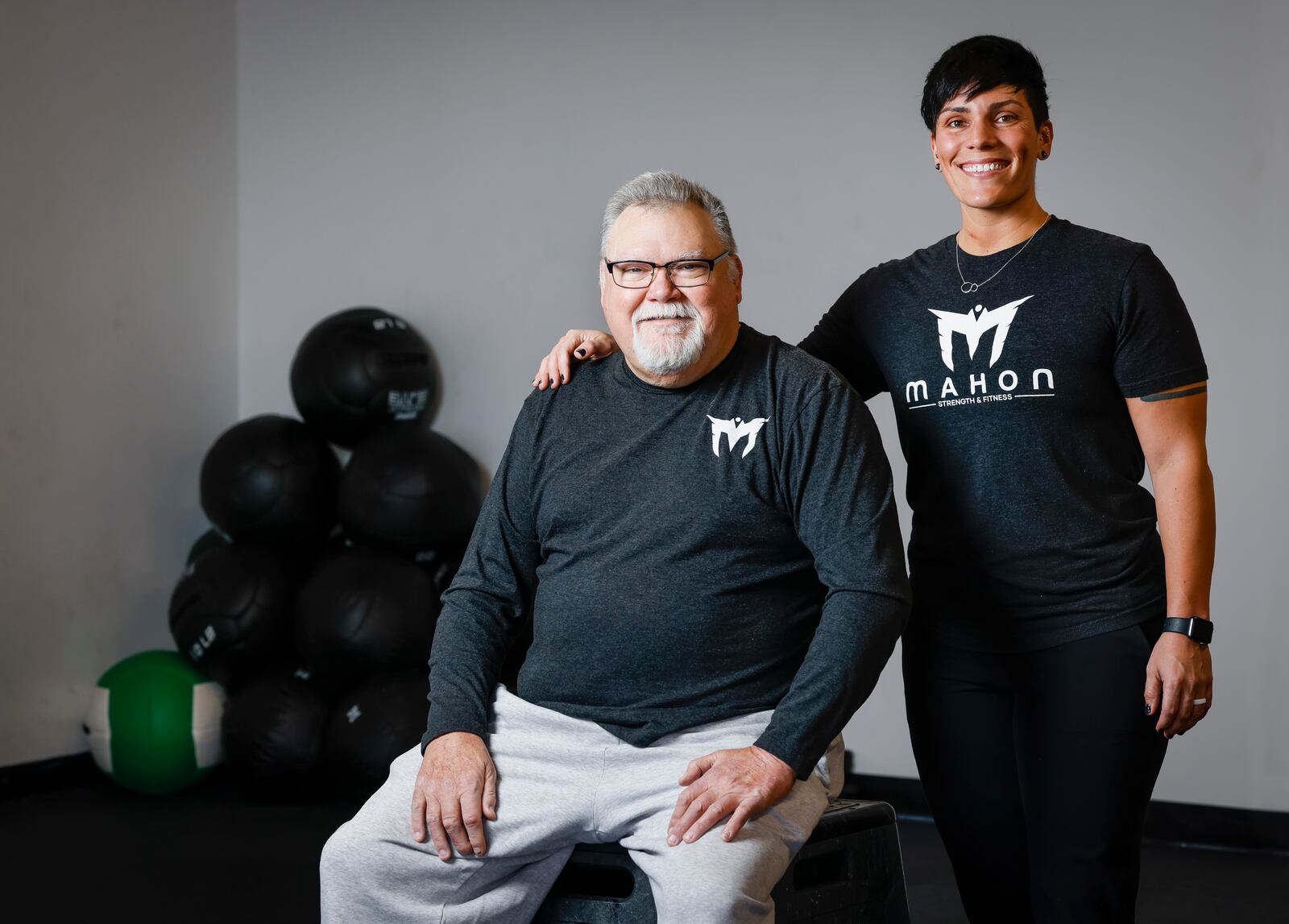 Bryan Watkins works with Mimi Mahon at Mahon Strength and Fitness on Brookwood Ave. in Hamilton Jan. 18, 2022. Mahon, donated a kidney to an exchange program when her mom needed a kidney. Watkins is trying to get in better shape with increase mobility while he waits for kidney tansplant. NICK GRAHAM / STAFF