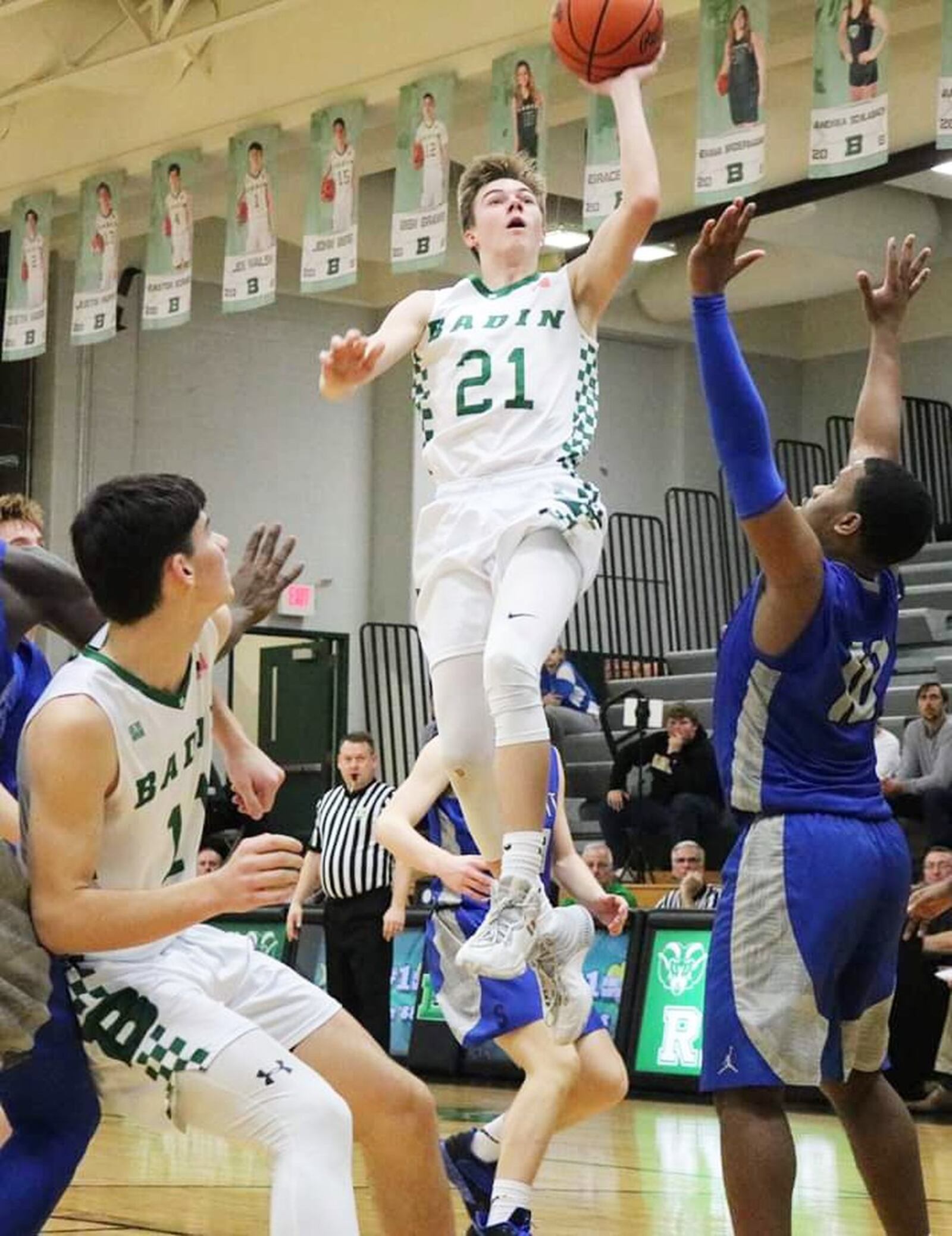 Badin’s Josh Hegemann (21) soars over Summit Country Day’s Rylan Woods (10) during Tuesday night’s game at Mulcahey Gym in Hamilton. Badin won 49-39. CONTRIBUTED PHOTO BY TERRI ADAMS