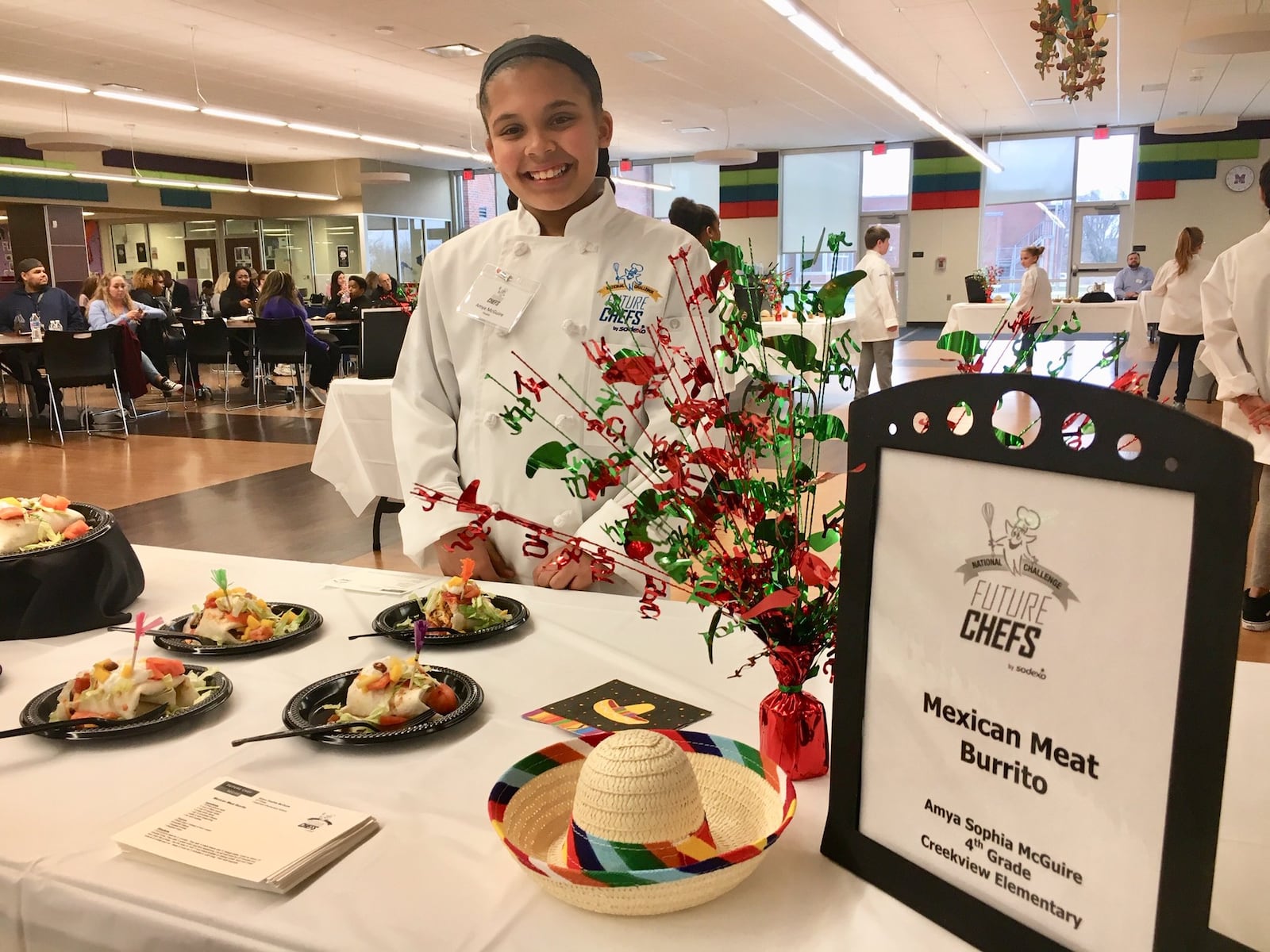 Middletown Schools 4th grader Amya Sophia McGuire proudly stands ready for taste judges to sample her just cooked Mexican meat burrito as part of the district’s annual “Future Chefs” competition. This year’s bake off among elementary students was held at Middletown High School’s new cafeteria kitchen. This year’s winner, Zoey Bunch of Miller Ridge Elementary, will now go on to the regional level of the national competition.