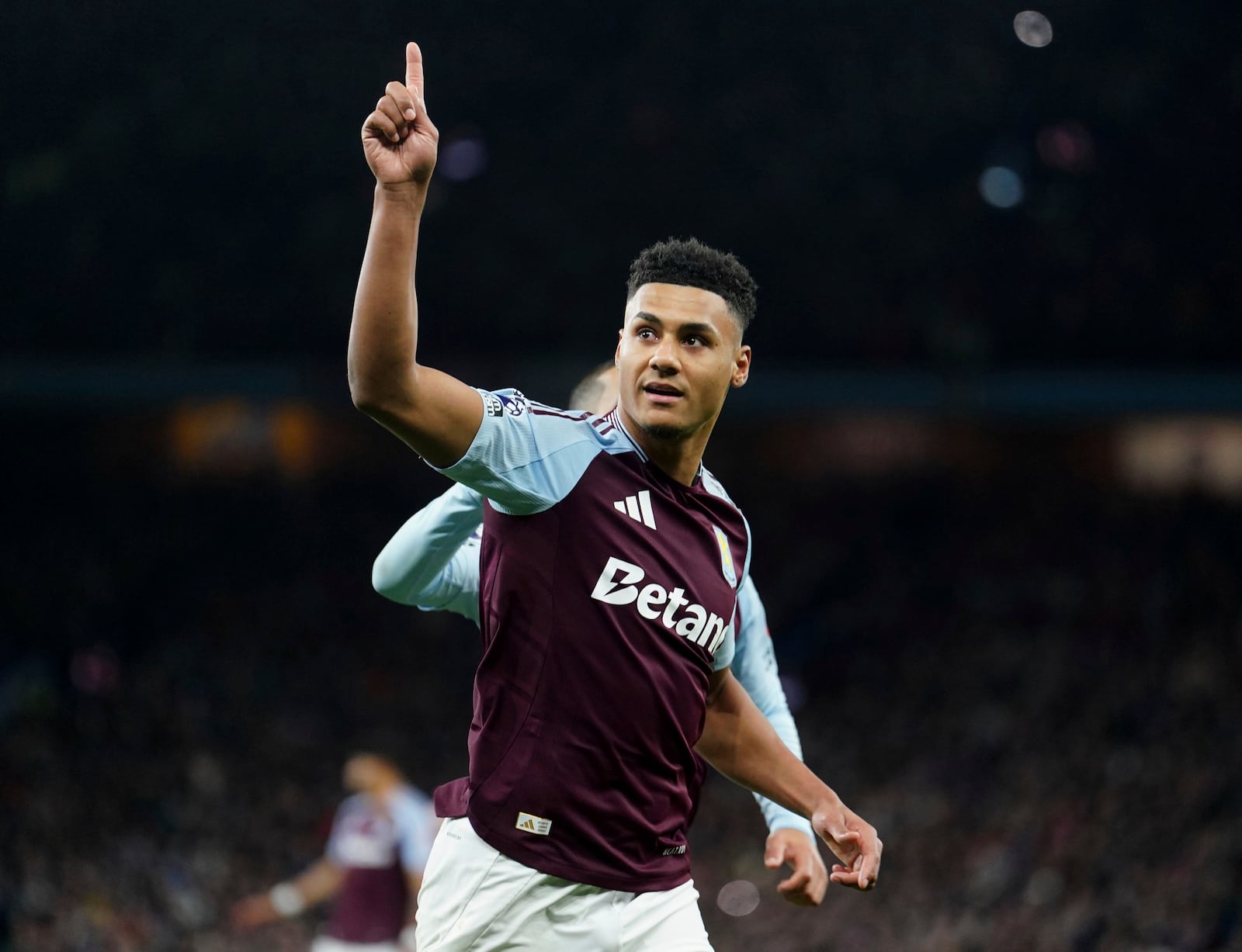 Aston Villa's Ollie Watkins celebrates scoring during the English Premier League soccer match between Aston Villa and Brighton and Hove Albion at Villa Park, Birmingham, England, Monday Dec. 30, 2024. (David Davies/PA via AP)