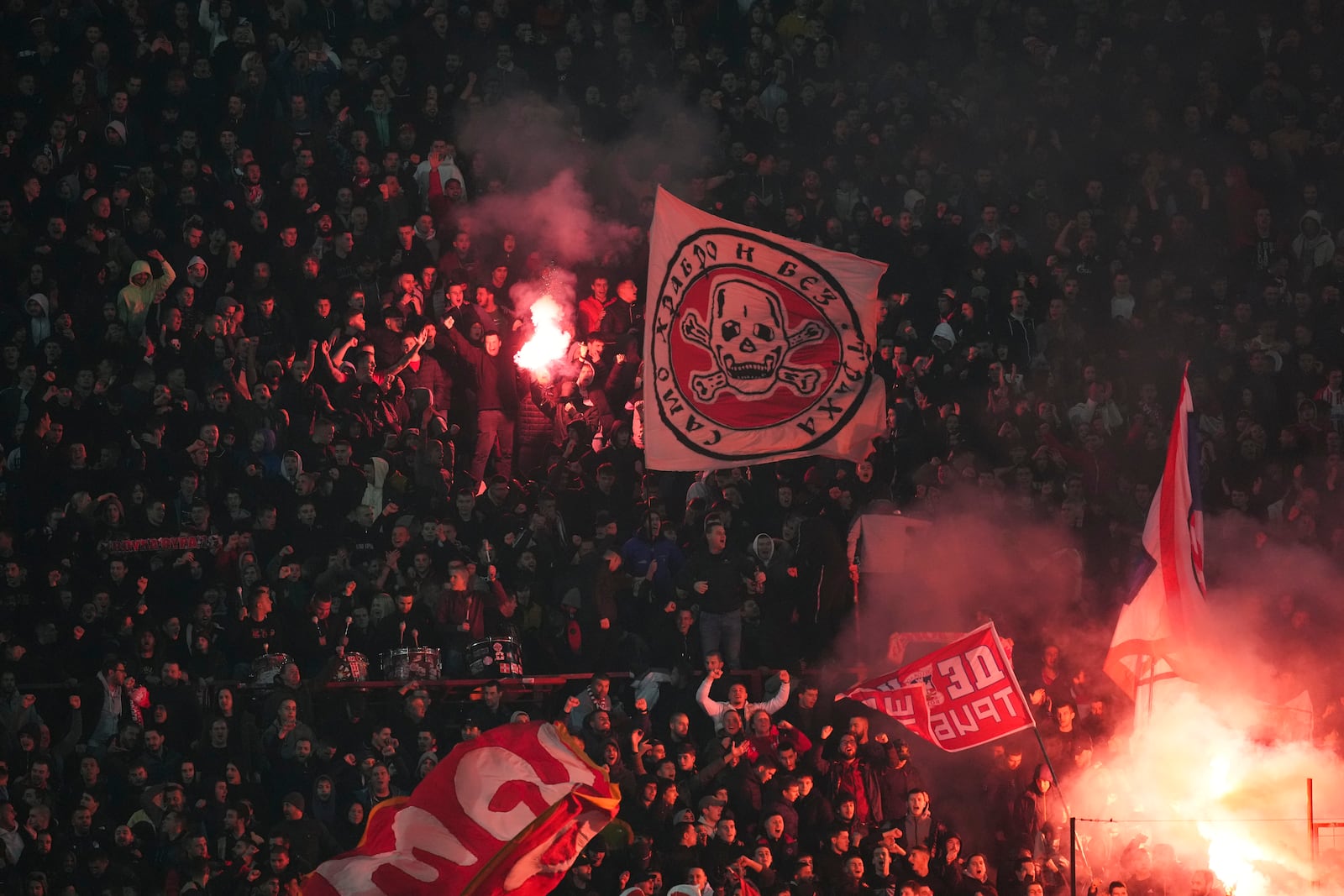 Supporters of Red Star celebrate after Mirko Ivanic scored his side's third goal during the Champions League opening phase soccer match between Red Star and Stuttgart at the Rajko Mitic Stadium in Belgrade, Serbia, Wednesday, Nov. 27, 2024. (AP Photo/Darko Vojinovic)