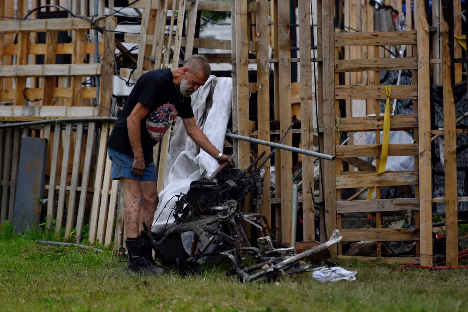 Jim Humphrey looks over the damage after a fire Wednesday night, May 10, at his home on Ludlow Street in Hamilton. He says in the four months he has lived at the home, he has often had to run vandals off the property.