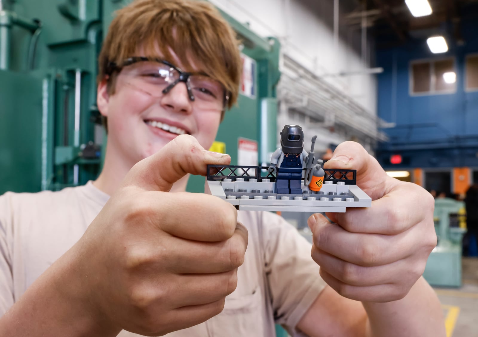 Senior welding student Landen Johnson shows off his lego mini figure during the ribbon cutting for the new welding lab at Butler Tech Thursday, Nov. 7, 2024. NICK GRAHAM/STAFF