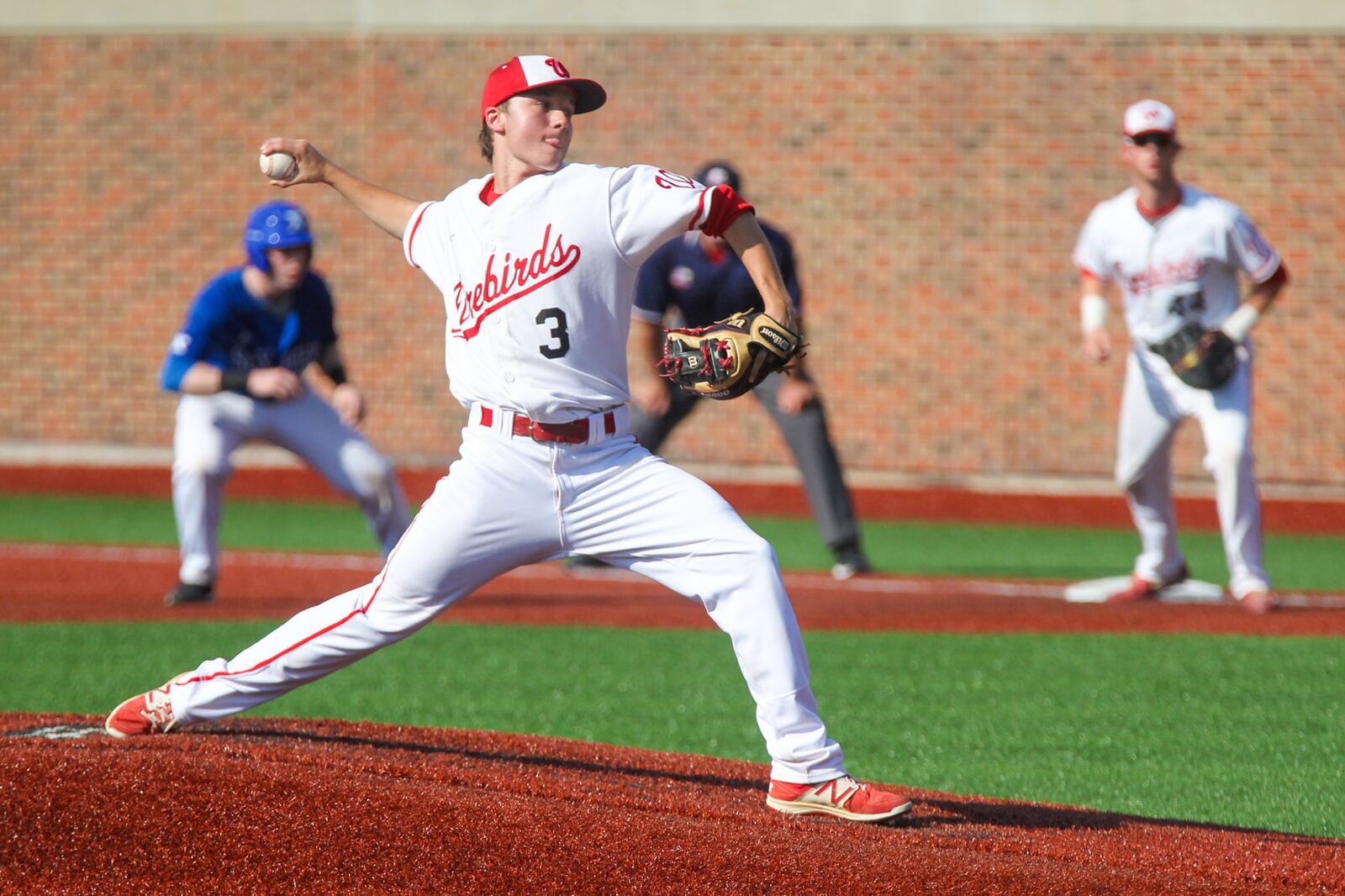 Lakota West pitcher Max Kiker deals on the mound during Friday’s 2-1 victory over St. Xavier in a Division I regional final at the University of Cincinnati’s Marge Schott Stadium. GREG LYNCH/STAFF