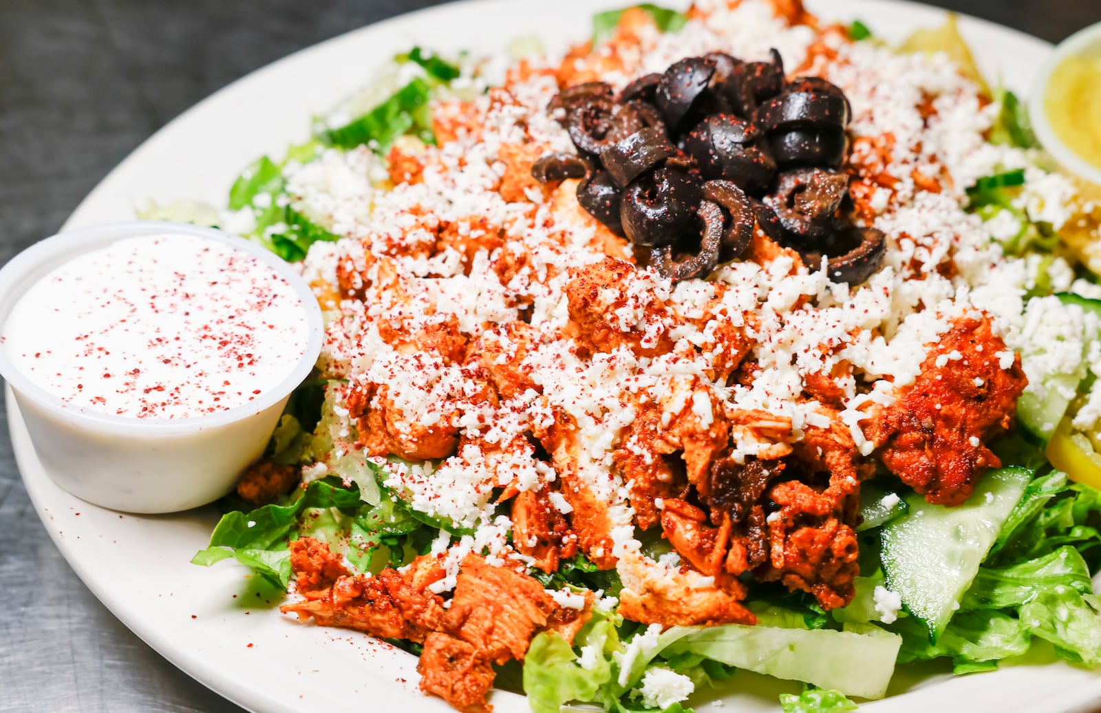 A chicken shawarma salad is served at Tikka Grill in West Chester Township. Tikka Grill has locations on Cincinnati Dayton Road in West Chester Township and inside Jungle Jim's Eastgate. Tikka Grill serves a variety of food items including gyros, pita wraps, subs, Greek salads, shawarma, wings and more.