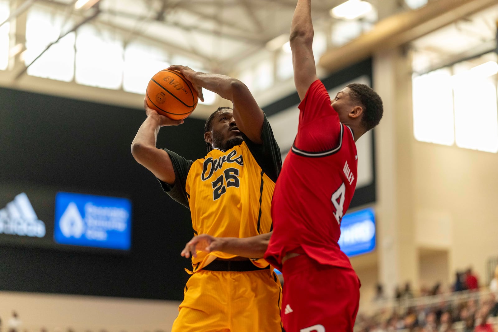 Kennesaw State forward Rongie Gordon (25) attempts a basket against Rutgers guard Ace Bailey (4) during the first half of an NCAA college basketball game, Sunday, Nov. 24, 2024, in Kennesaw, Ga. (AP Photo/Erik Rank)