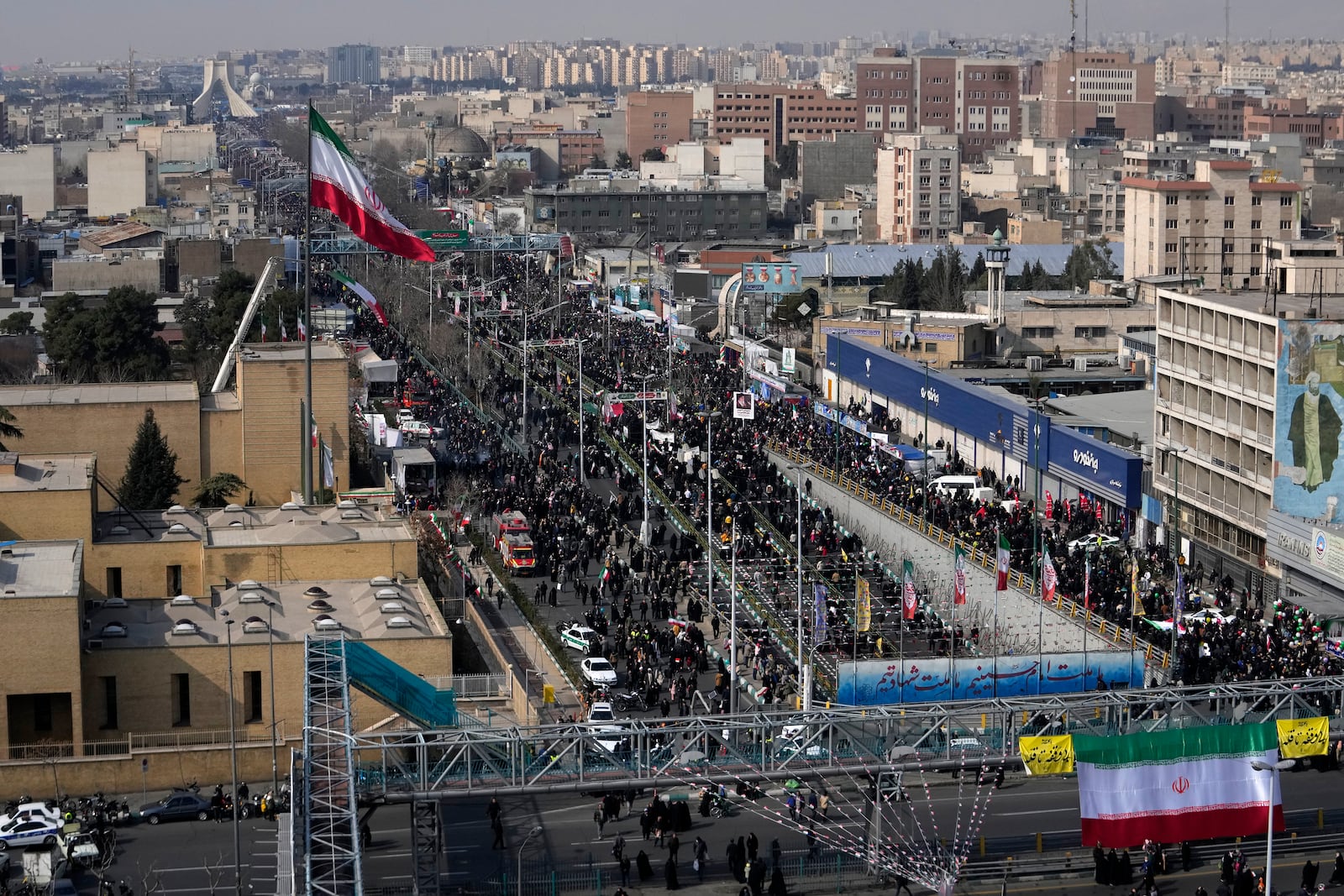 Iranians march during a rally commemorating anniversary of 1979 Islamic Revolution that toppled the late pro-U.S. Shah Mohammad Reza Pahlavi and brought Islamic clerics to power, in Tehran, Iran, Monday, Feb. 10, 2025. (AP Photo/Vahid Salemi)