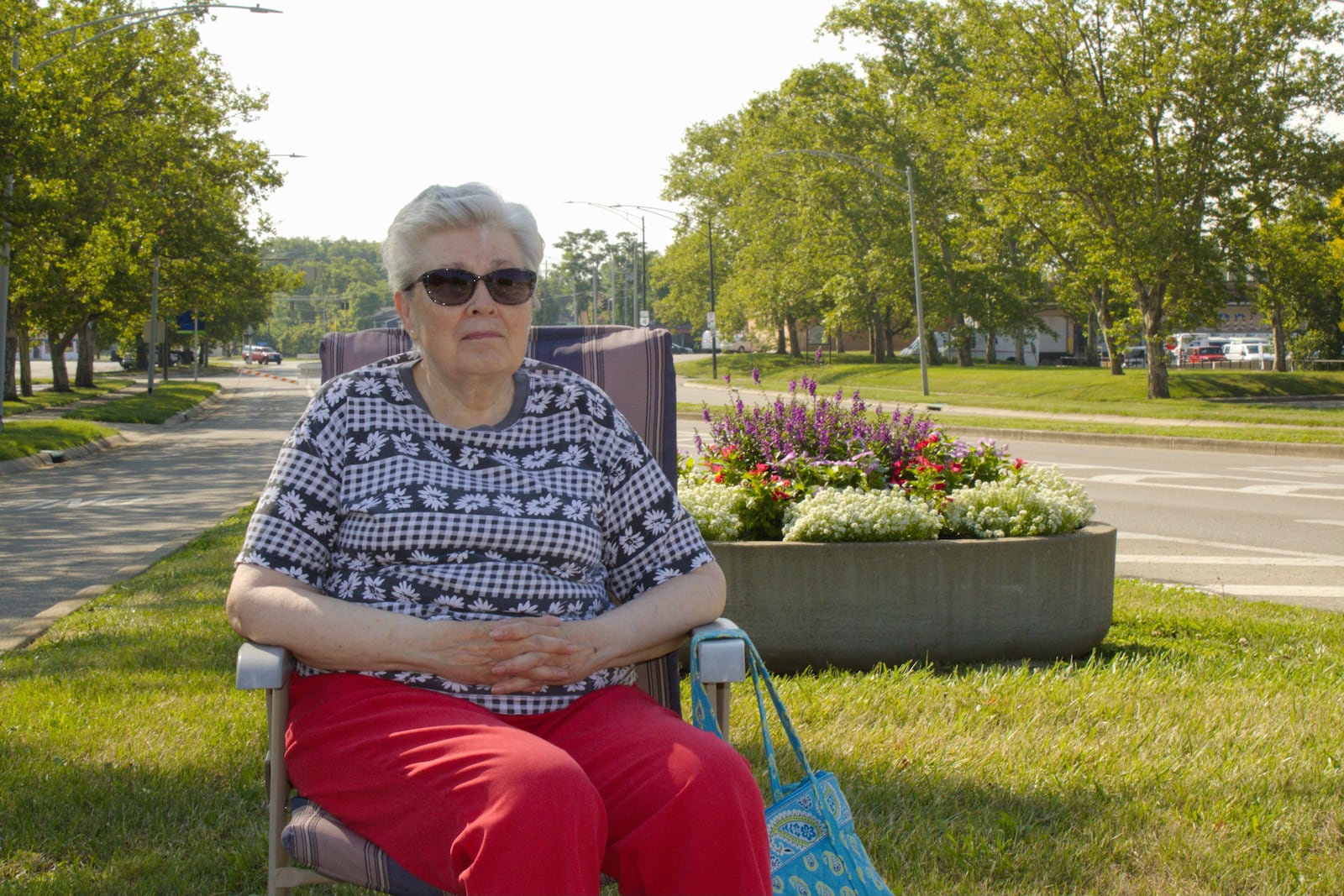 Ann Phillabaum had a median all to herself to watch the Middletown Independence Day parade.