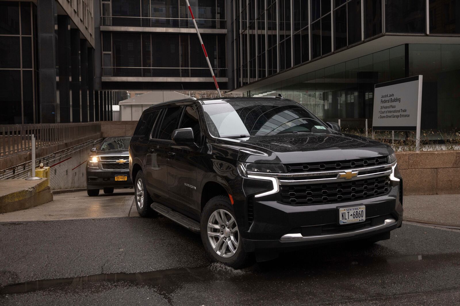 A car carrying Border Czar Tom Homan drives out of the Federal Plaza, Thursday, Feb. 13, 2025, in New York. (AP Photo/Yuki Iwamura)