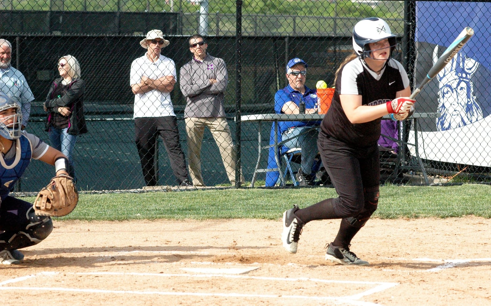 Middletown’s Paige Patterson takes a swing and starts to run toward first base Tuesday during a Division I district softball semifinal against Fairmont at Miamisburg. Fairmont won 7-2. RICK CASSANO/STAFF