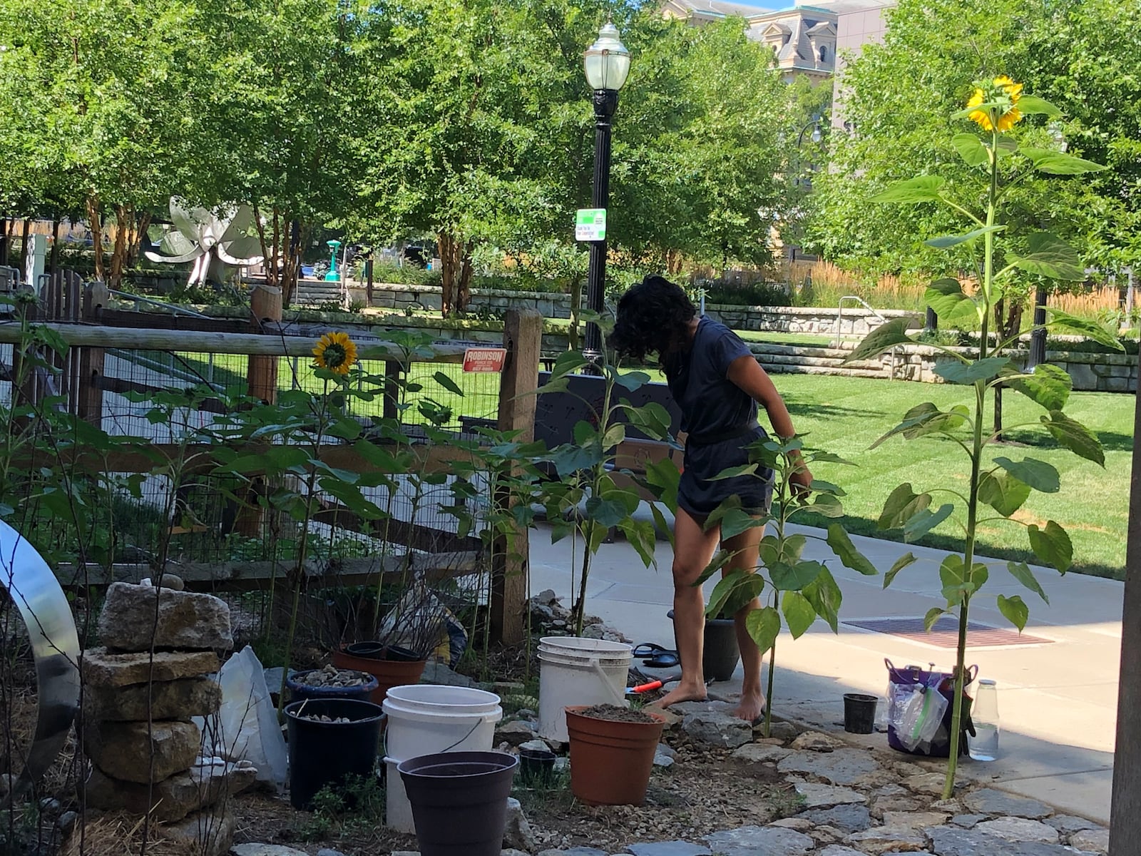 Hamilton artist Laurana Wong recently has been working on an Art Garden near where the murals will be painted this weekend. MIKE RUTLEDGE/STAFF