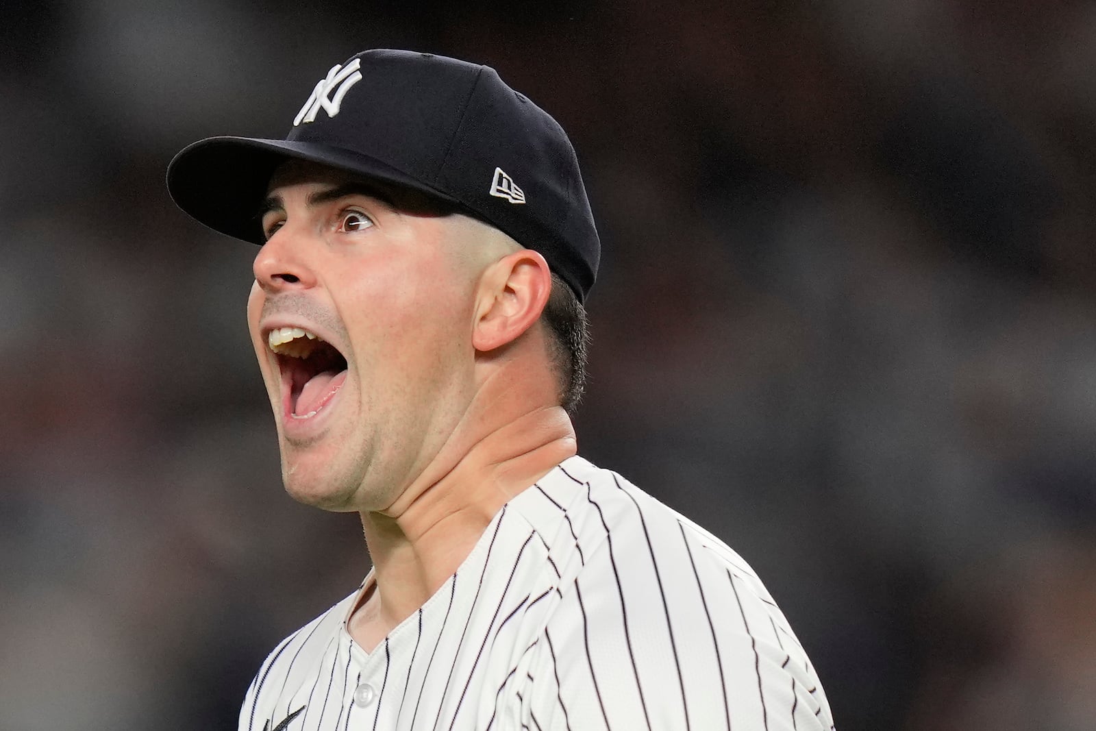 New York Yankees pitcher Carlos Rodón (55) reacts after striking out the batter during the first inning of Game 2 of the American League baseball playoff series against the Kansas City Royals, Monday, Oct. 7, 2024, in New York. (AP Photo/Seth Wenig)