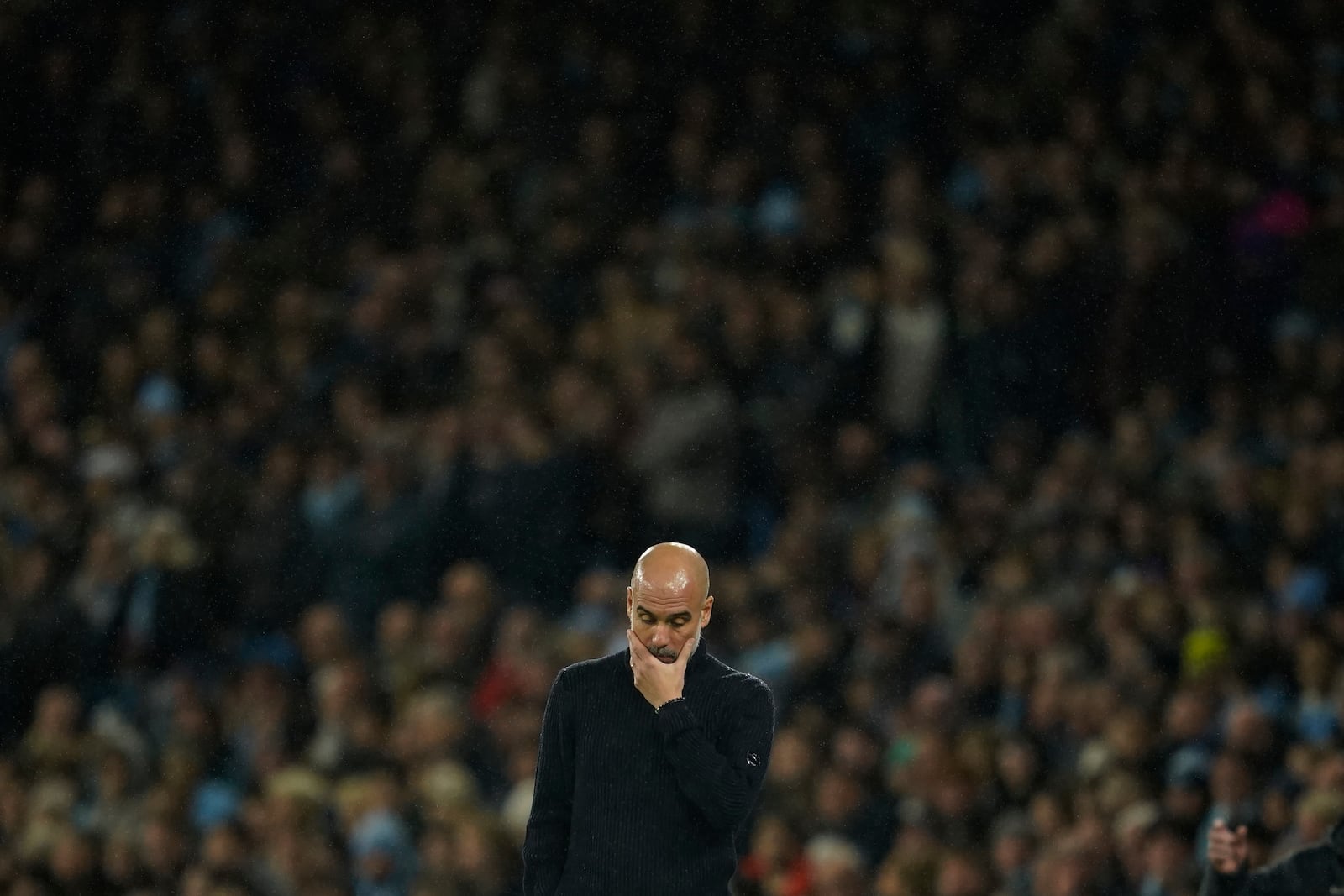 Manchester City's head coach Pep Guardiola reacts during the English Premier League soccer match between Manchester City and Tottenham at the Etihad Stadium in Manchester, England, Sunday, Nov. 24, 2024. (AP Photo/Dave Thompson)