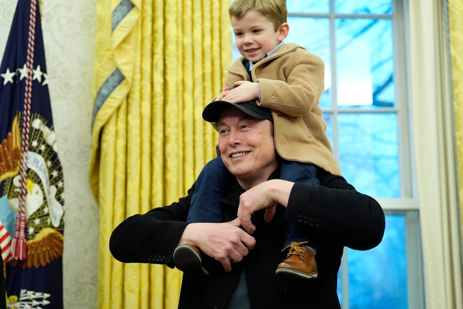 Elon Musk, joined by his son X Æ A-Xii, speaks in the Oval Office at the White House, Tuesday, Feb. 11, 2025, in Washington, during an event with President Donald Trump. (Photo/Alex Brandon)