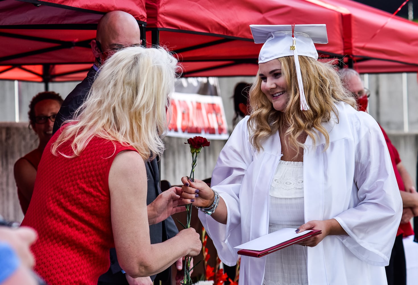 Madison High School drive-thru graduation ceremony at Land of Illusion