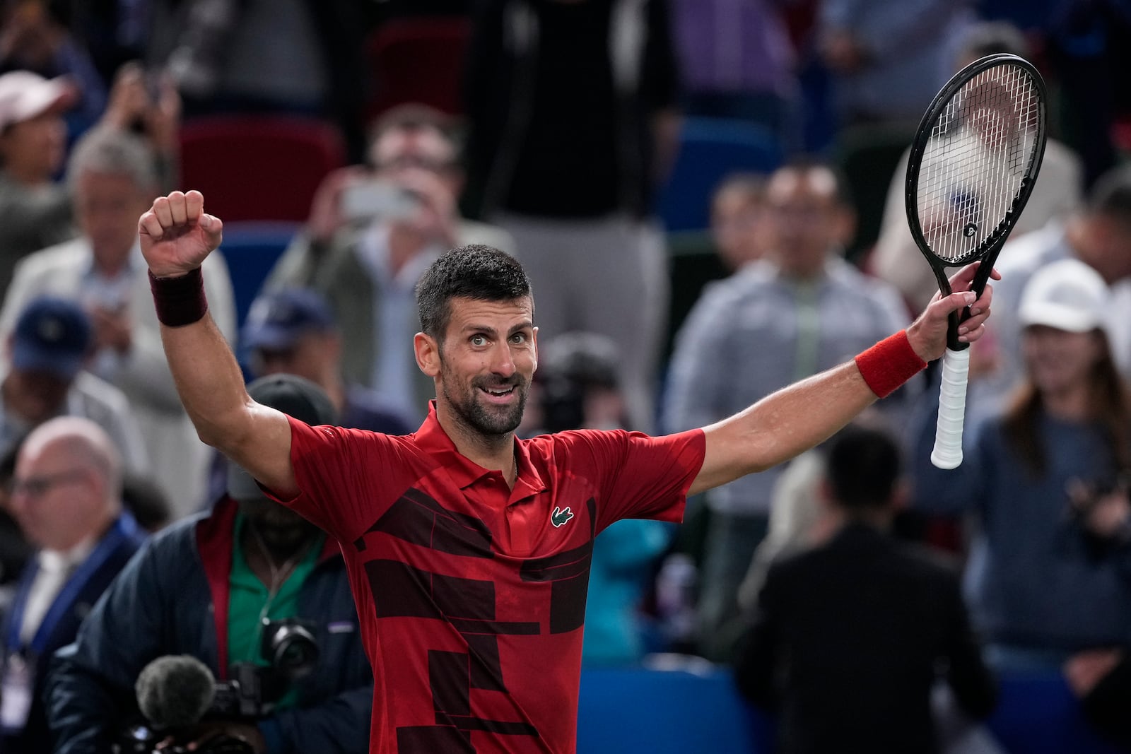 Novak Djokovic of Serbia celebrates after defeating Taylor Fritz of the United States in the men's singles semifinals match of the Shanghai Masters tennis tournament at Qizhong Forest Sports City Tennis Center in Shanghai, China, Saturday, Oct. 12, 2024. (AP Photo/Andy Wong)