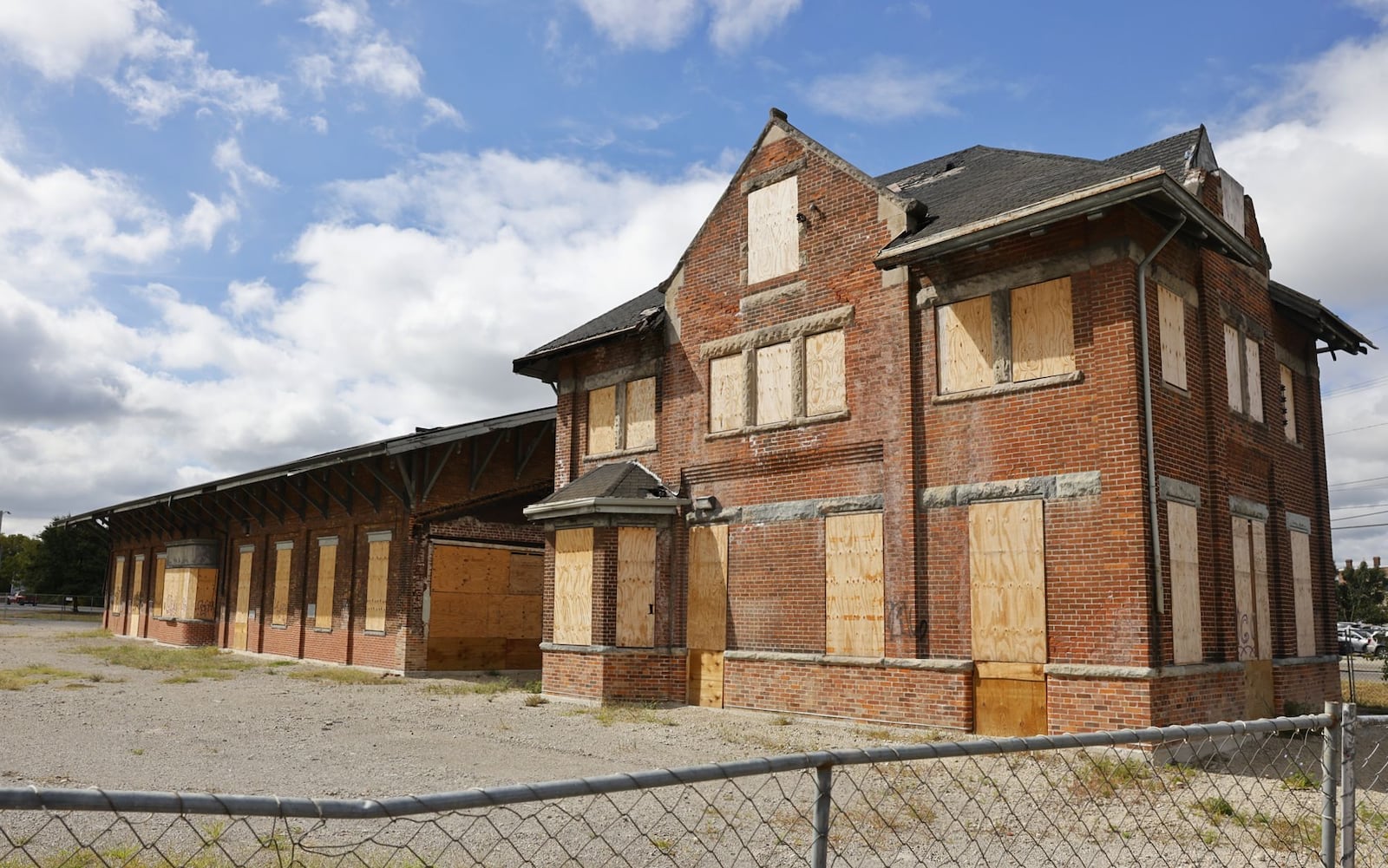 Hamilton city leaders are putting together a detailed plan to get the roof replaced, brick repaired, and the windows restored or replaced in the former CSX depot buildings. The buildings were relocated north, about 1,500 feet along MLK Jr. Boulevard in December 2022 and January 2023. Pictured are the buildings on Sept. 25, 2023. NICK GRAHAM/STAFF