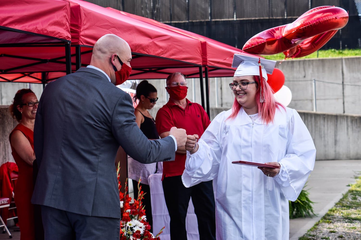 Madison High School drive-thru graduation ceremony at Land of Illusion