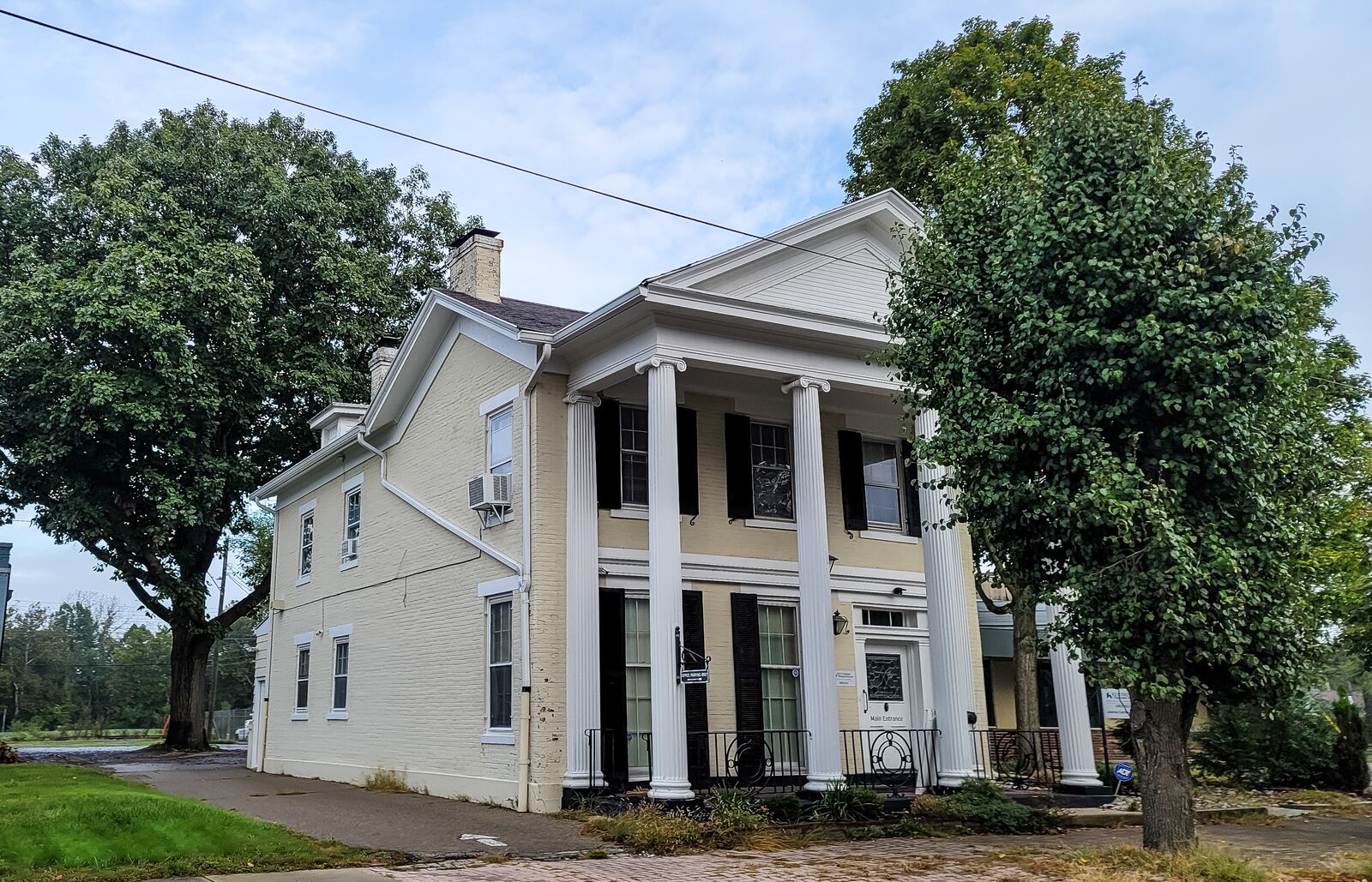 The buildings along South Main Street between 1st Ave. and 2nd Ave., including the Kettering Health Urology office, would need to be removed, remodeled or built around if Main Street Community Capital were allowed to design and build "Hollywoodland" as presented on more than 50 acres near the Great Miami River and historic downtown Middletown. City council members appear to be divided on the feasibility of the $1.3 billion proposed entertainment, event, dining and retail project. NICK GRAHAM / STAFF