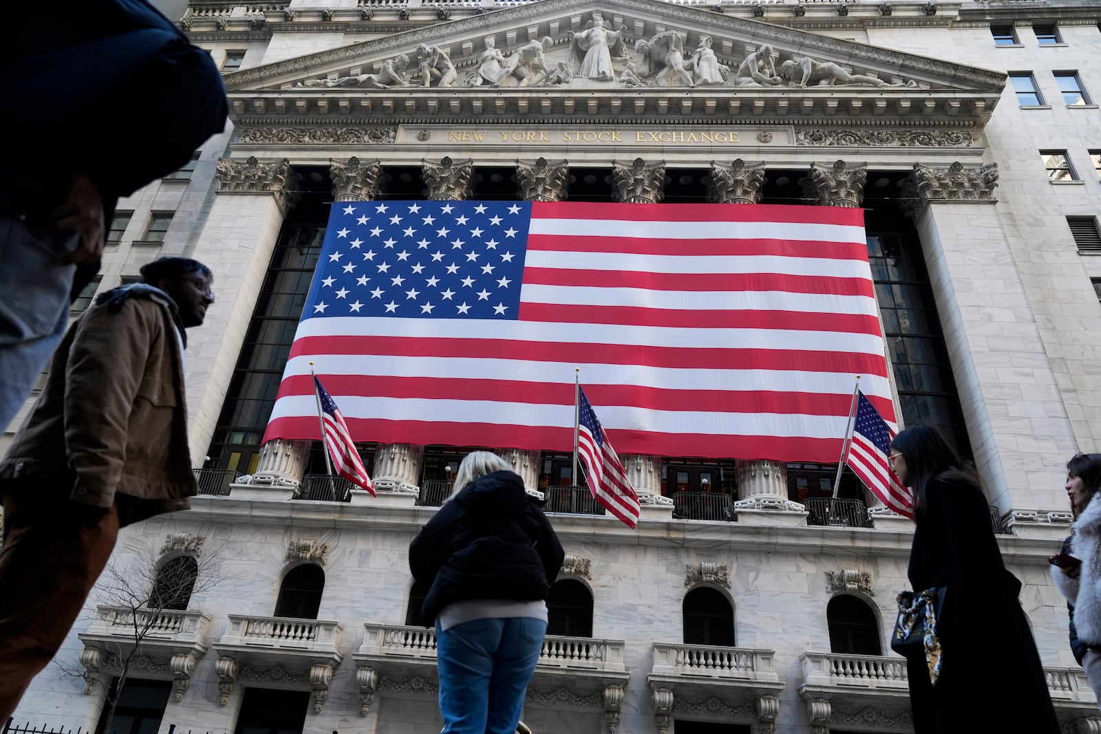 An American flag is displayed on the New York Stock Exchange in New York, Monday, Feb. 24, 2025. (AP Photo/Seth Wenig)