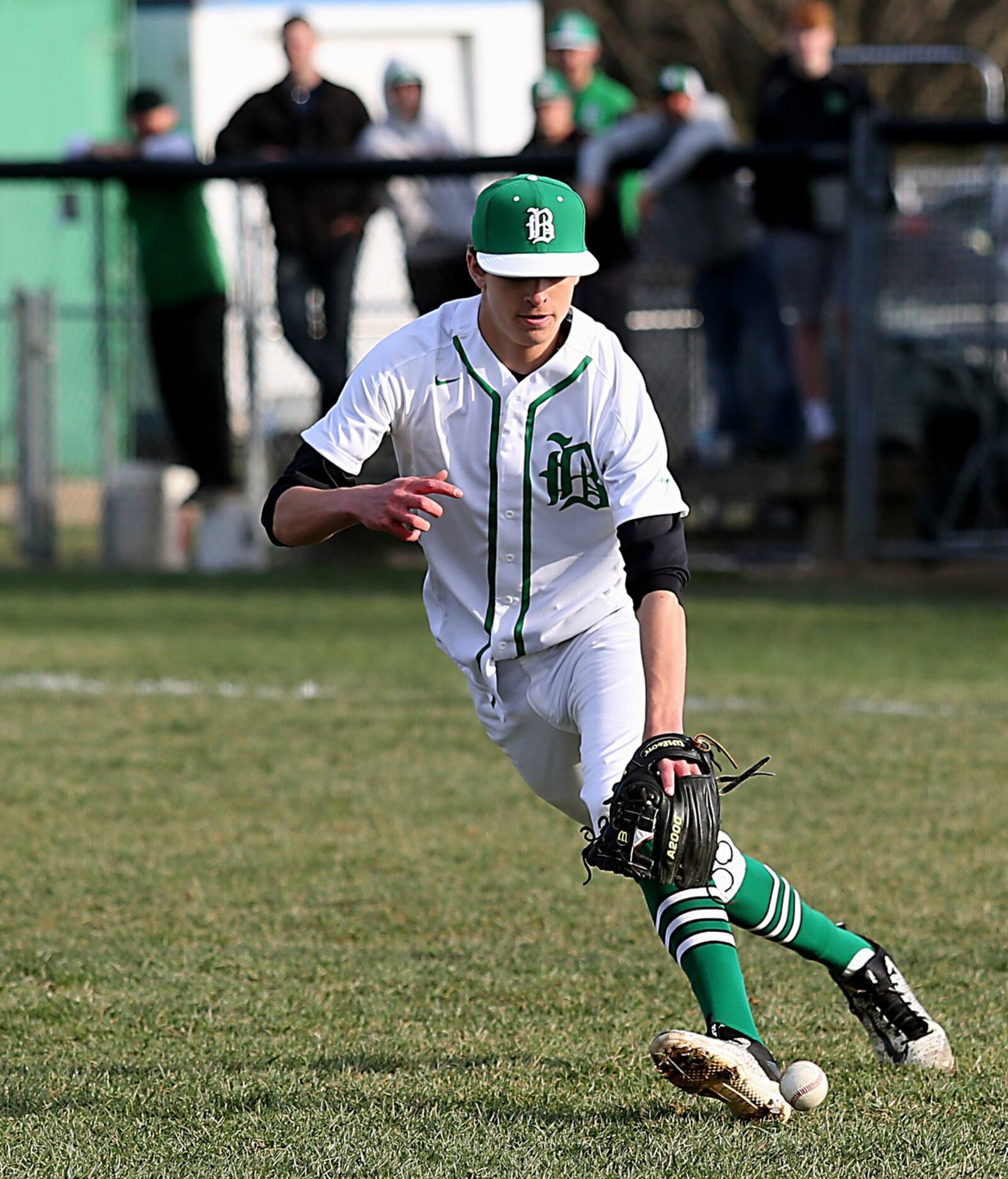 Badin pitcher Andrew Noelker chases a Defiance bunt during Wednesday’s game at Alumni Field in Hamilton. CONTRIBUTED PHOTO BY E.L. HUBBARD