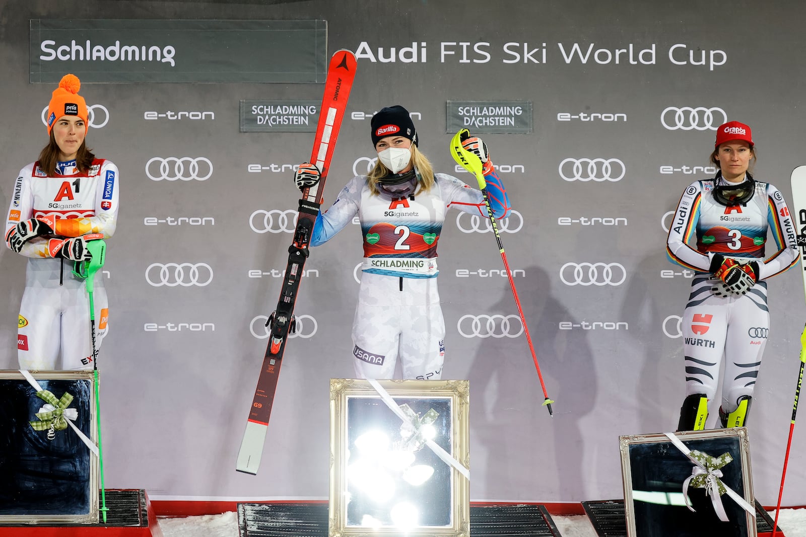 FILE - United States' Mikaela Shiffrin, center, winner of an alpine ski women's World Cup slalom, poses with second placed Slovakia's Petra Vlhova, left, and third placed Germany's Lena Duerr, in Schladming, Austria, Tuesday, Jan. 11, 2022. (AP Photo/Giovanni Maria Pizzato, File)