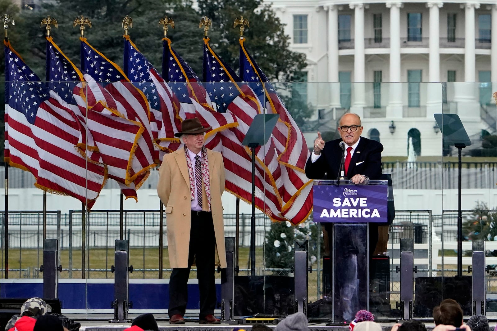 FILE - Chapman University law professor John Eastman stands at left as former New York Mayor Rudolph Giuliani speaks in Washington at a rally in support of President Donald Trump, called the "Save America Rally" on Jan. 6, 2021. (AP Photo/Jacquelyn Martin, File)