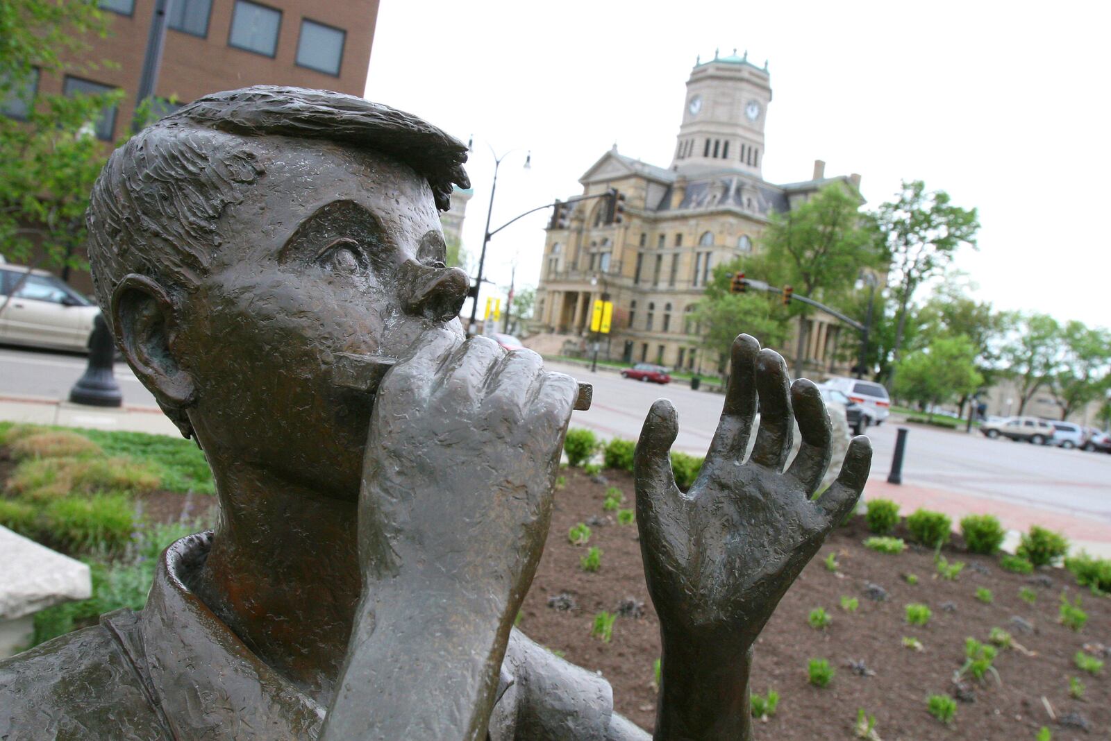 Lentil, a character in Robert McCloskey's first book "Lentil," plays the harmonica for all of downtown Hamilton in Lentil Park.