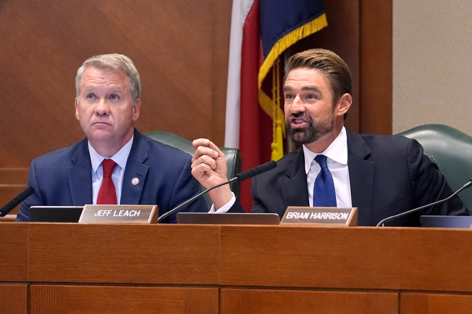 Texas Rep. Jeff Leach, R-Plano, right, poses a question to a witness as Rep. David Cook, R-Mansfield, left, listens during a committee hearing regarding the death row case of Robert Roberson, Monday, Oct. 21, 2024, in Austin, Texas. (AP Photo/Tony Gutierrez)